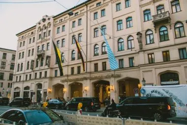 Modern bedroom with dark walls and bright window